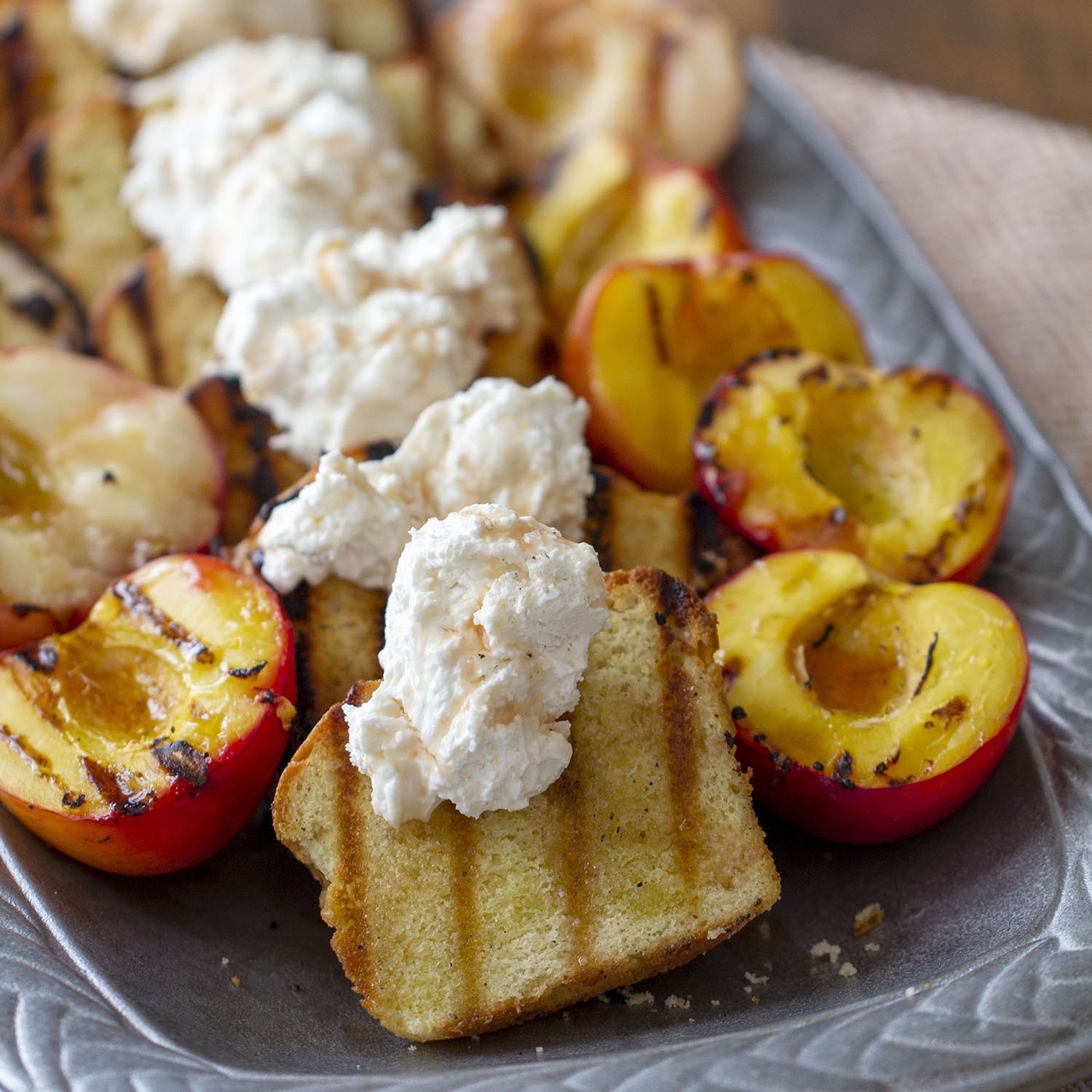GRILLED POUND CAKE & STONE FRUIT WITH SALTED STRAWBERRY WHIPPED CREAM