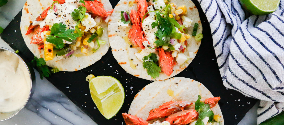 Salmon Tacos with Grilled Corn and Jalapeño Salsa and a Lime Crema